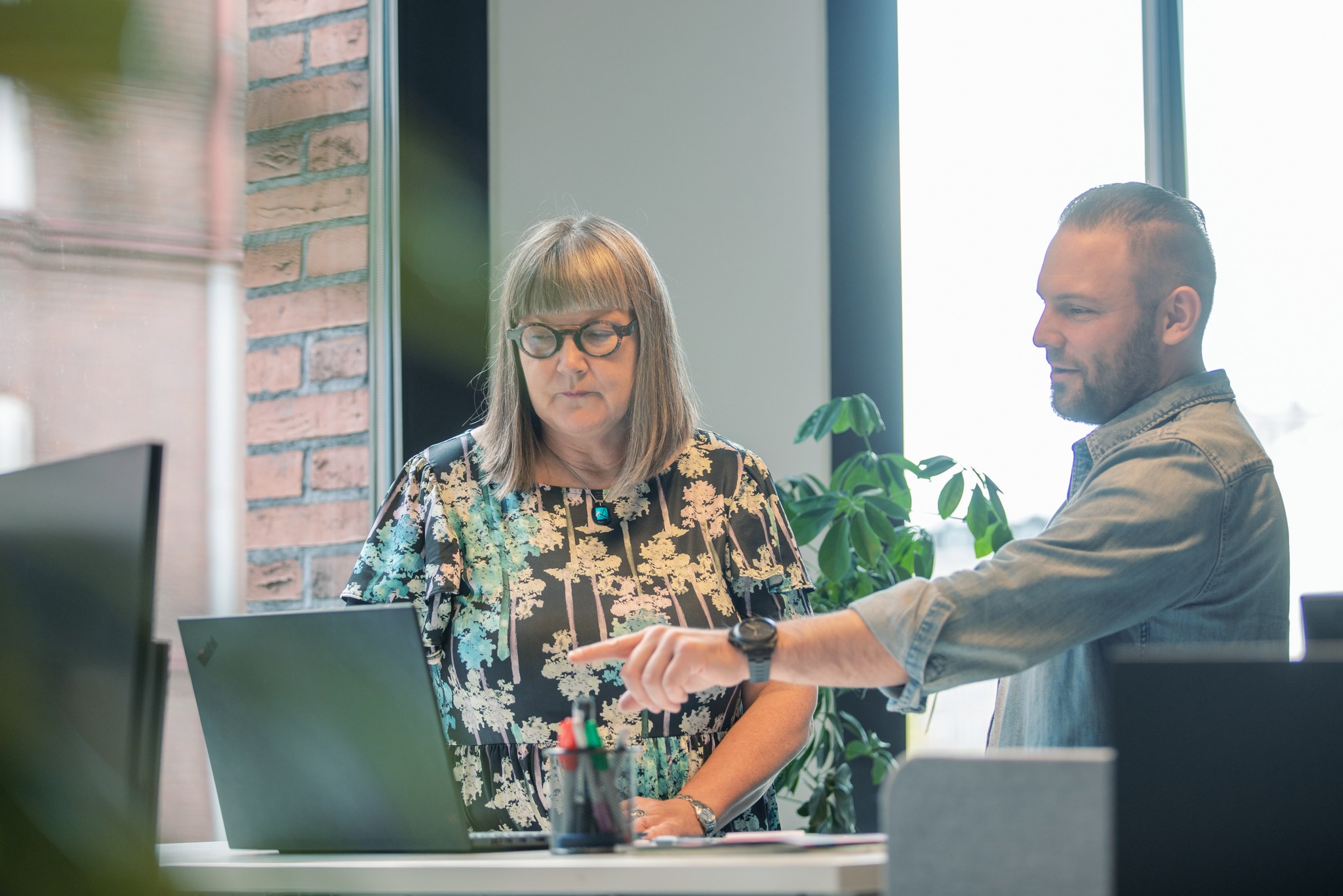 man and woman working together