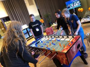 Goforeans challenging attendees to foosball