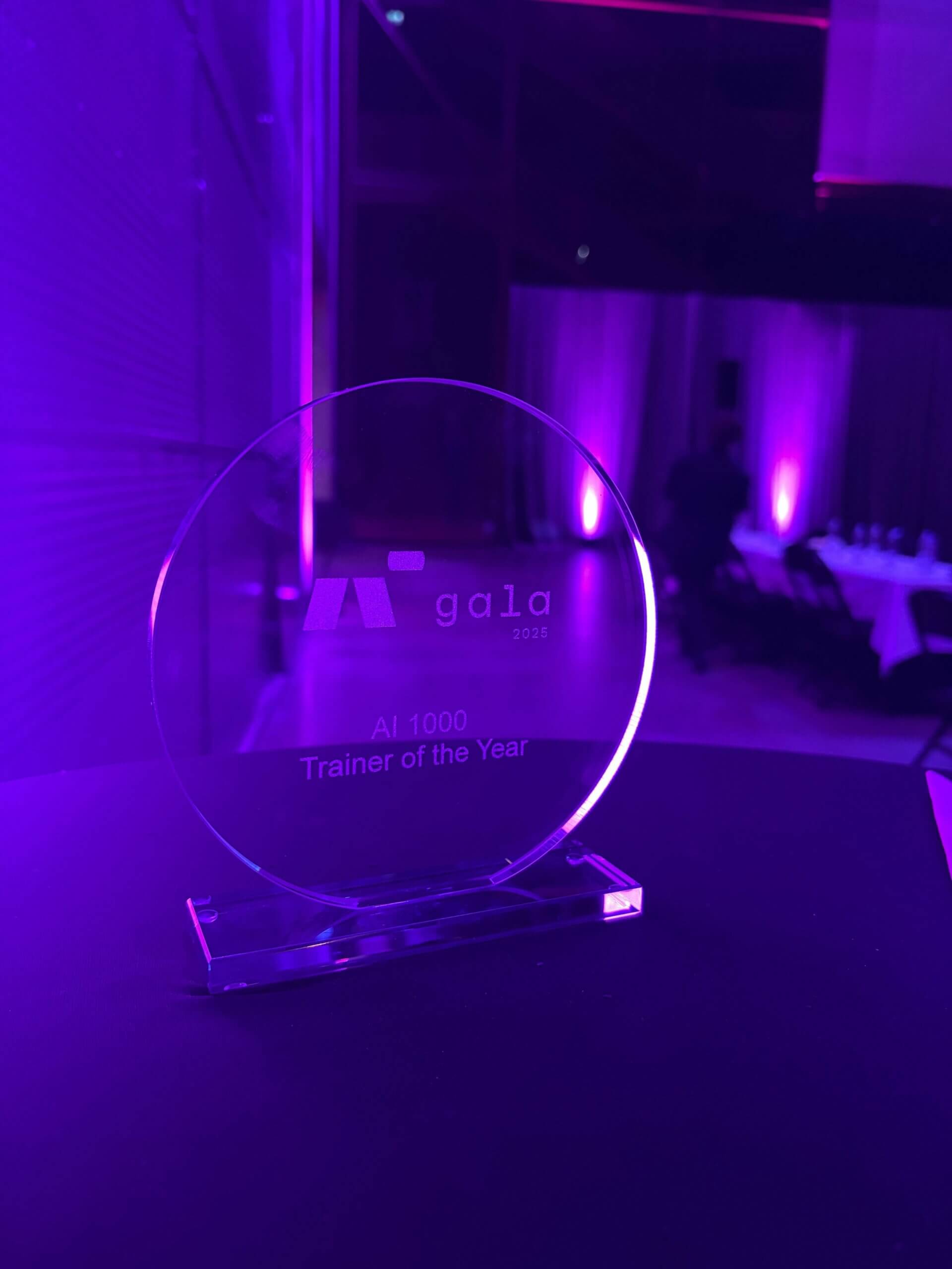 See-through glass trophy of AI Gala Trainer of the Year award
