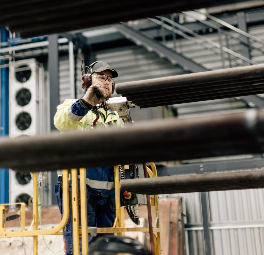 Person working in an industrial environment.