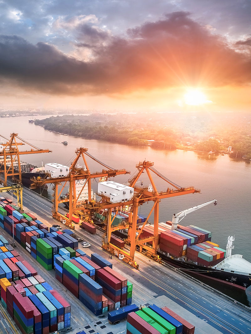 Shipping yard with containers, cranes and a cargo ship