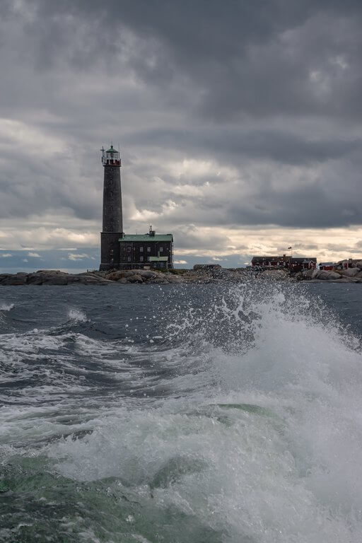 Lighthouse in the middle of storming sea waves